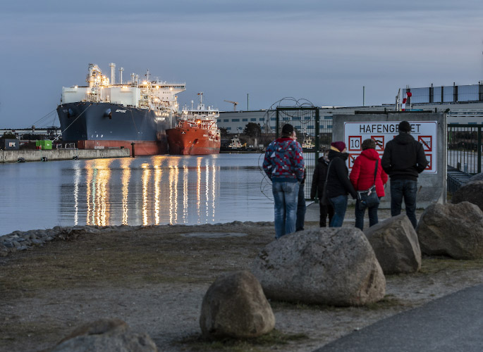 Floating LNG Terminal Neptune with Shuttle Tanker Coral Favia at Lubmin Inner Harbour. Germany 2023