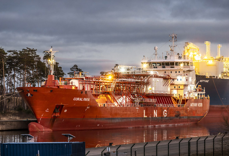 Floating LNG Terminal Neptune with Shuttle Tanker Coral Favia at Lubmin Inner Harbour. Germany 2023