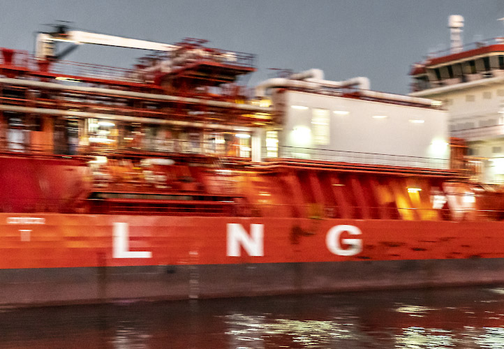 Floating LNG Terminal Neptune. Shuttle Tanker Coral Furcata tugged into Lubmin Inner Harbour. Baltic Sea Germany 2023