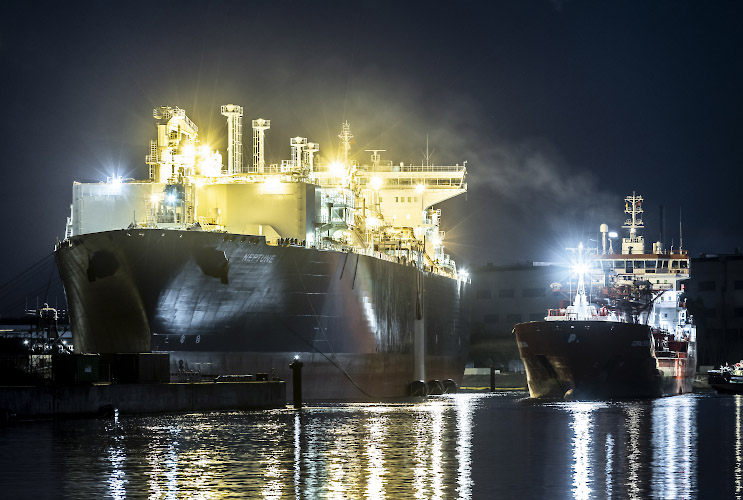 Floating LNG Terminal Neptune with Shuttle Tanker Coral Furcata at Lubmin Inner Harbour. Baltic Sea Germany 2023