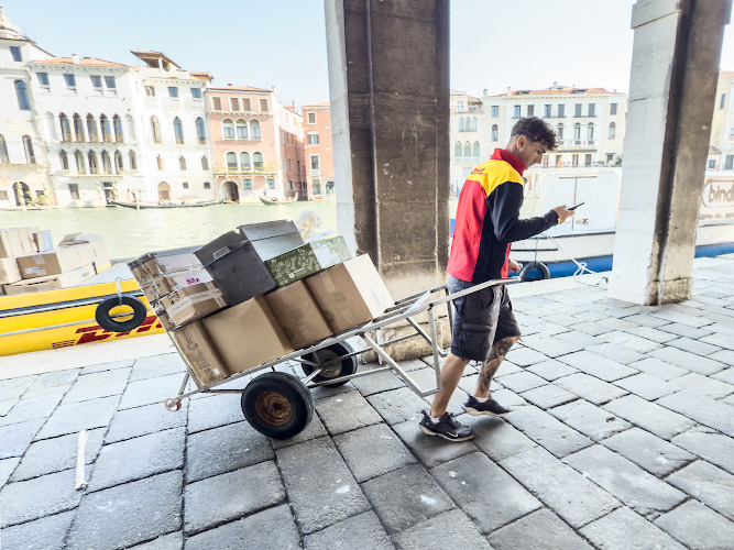 DHL Delivery Service. Excellence, simply delivered by low-emission. Venice Italy 2025